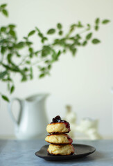 Cheesecakes with jam stacked on a plate