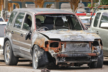 Fototapeta premium The wreckage of the accident car was left outdoors to be repaired.