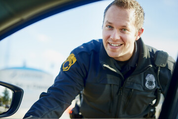 Afternoon. Just a routine stop and go. Cropped portrait of a handsome young male traffic officer...