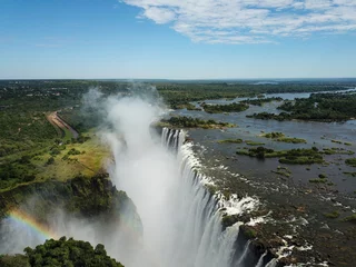 Foto op Aluminium Victoria Falls at the Border of Zimbabwe and Zambia in Africa. The Great Victoria Falls One of the Most Beautiful Wonders of the World. Unesco World Heritage. Aerial Shot From Above. © Uldis
