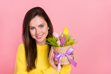 Photo of young adorable woman hold colorful basket green grass party isolated over pink color background - Powered by Adobe