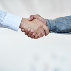 Youve got yourself a deal. Cropped shot of two businesspeople shaking hands.
