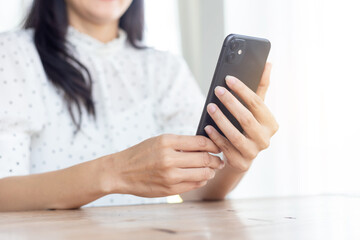 woman using cell phone hand holding mobile texting message contact us.chatting,search internet information.technology device communication connecting