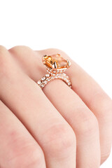 Diamond Ring. Wedding Ring. Close up Diamond ring on woman's finger before wedding. Close up of elegant diamond ring on the finger.