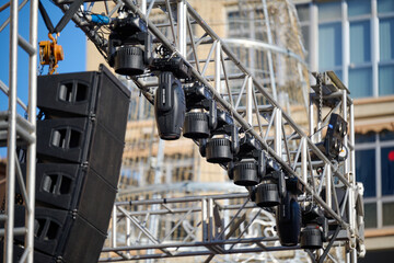 stage lights and speaker on truss