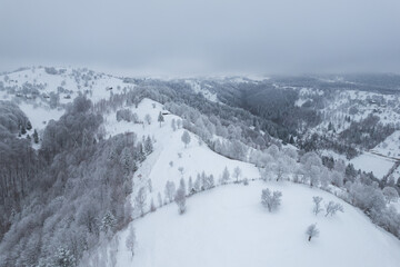 Winter landscape in rural Transylvania. Snowy scene in the Romanian mountains