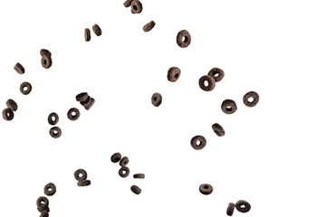 Chocolate rings cereal spill out into a bowl. Breakfast.