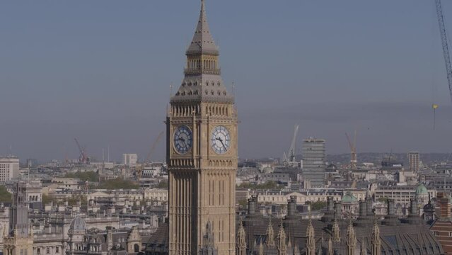 Aerial drone telephoto close up shot of Big Ben with London city in the background