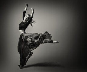 Woman dancer Jumping in Silk Dress, Modern Ballet Dancer , Fluttering Waving Cloth, Gray...