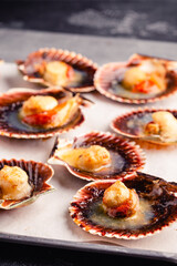 Cooked scallops with melted butter