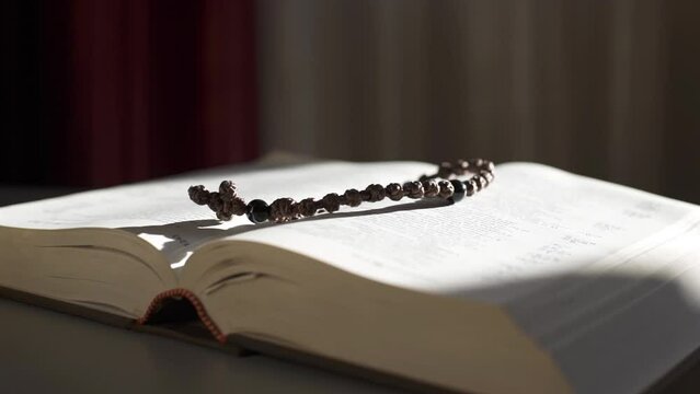 Light falls on the holy bible. Feeling the presence of God