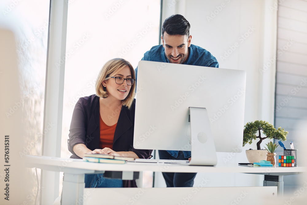 Aufkleber putting technology to work. shot of a young man and woman using a computer together in a modern offi