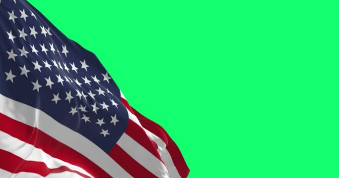 The flag of the United States of America waving isolated on a green background