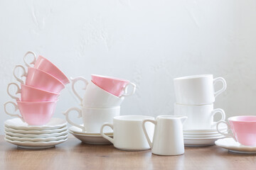 group of different cups on wooden table on white background