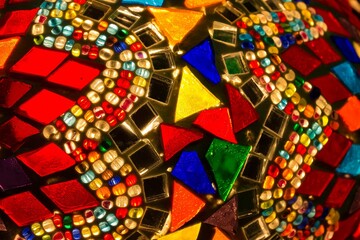 Colourful macro shot of a brightly coloured oriental mosaic lamp.