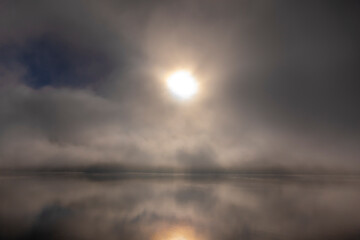 Cloudy Alpine Lake Lugano with Sunlight and Clouds on Surface Level in Lugano, Switzerland.