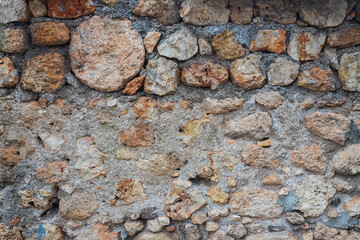 close up of the walls made of stone , stone background.
