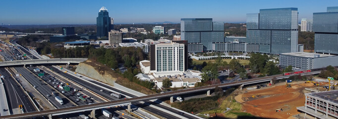 Panorama aerial Skytrain railway, elevated bypass, busy traffic on Highway I-285 (the Perimeter),...