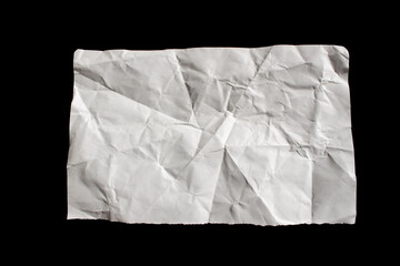 Crumpled torn paper piece isolated on a black background. Ripped paper sheet.