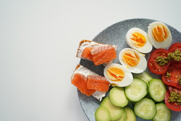 healthy breakfast, bread with salmon, eggs, keto