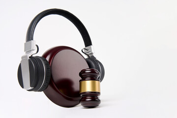 Fototapeta na wymiar Music copyright law concept. Headphones and judge gavel