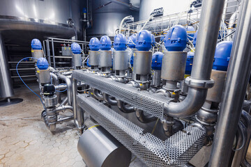 The process pipe valve is stainless at the in-process area of the pipeline flowing stainless food...