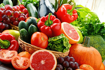 Naklejka na ściany i meble Colorful basket with the fresh fruits and vegetables 