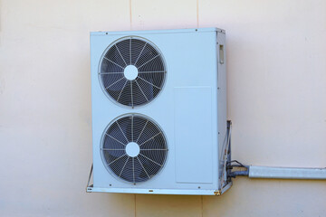 home air conditioner coil or condenser with 2 blades with motor installed outside the building...