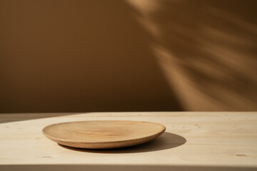 Rustic wood plate mockup and shadows on the wall. Background for food products cosmetics or...
