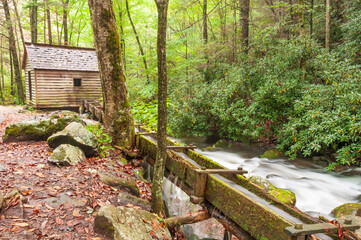 Historic house and old grist tub mill by the stream in the The valley of the Roaring Fork, the Great Smoky Mountains, Tennessee, USA - 576341963