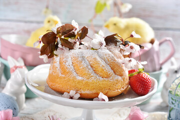 Easter table with a ring cake and spring decorations
