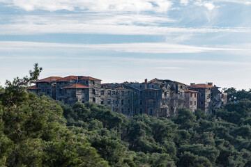 Fototapeta na wymiar A crumbling wooden building on top of a hill on Adalar Island in Istanbul.