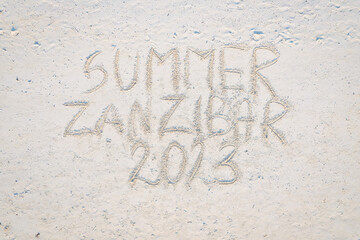 Etched into the sand of Zanzibar's vacation beach is a captivating inscription.