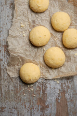 homemade ghee biscuits or cookies on table, against blurry white textured background, top view of melt in mouth nei biscuits, eggless cookies are made whole wheat flour, copy space