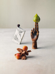 Conceptual still-life with varius object and fuit, figs, apricoat and cherry