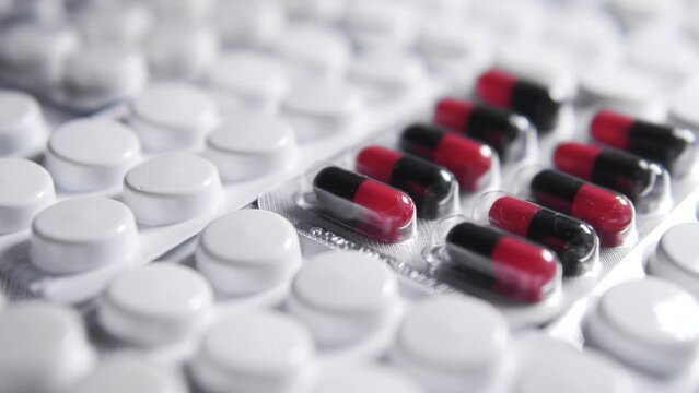 One blister of pills differing from others lying on table medicine in pharmaceutical blister packs, truly medicinal pills with proven efficacy stand out against the background of herbal medicines