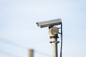 Remotely controlled CCTV camera on top of a pole.