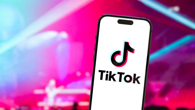 Madrid, Spain - February 24, 2023: TikTok logo on mobile phone. TikTok is a video-sharing app that allows users to create and share short-form videos on variety of topics.