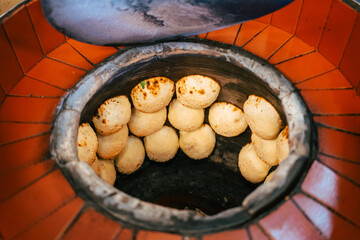 Fresh Hu Jiao Bing buns are baked in a hot oven. Traditional street food from Taiwan.