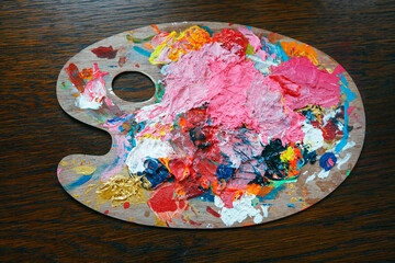 palette of artist with colorful paints