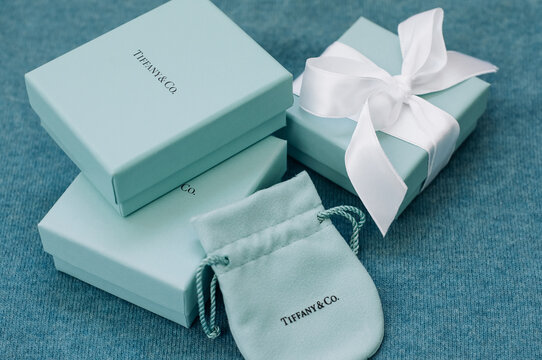 Two brand Tiffany box, a box with silk ribbon and velvet pouch.