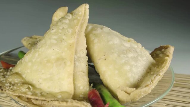 Potato samosa on with Sauce or Tomato Ketchup, Traditional indian or pakistani ramadan food, Ramzan iftar meal, Spicy street food, Famous snacks in asian country.