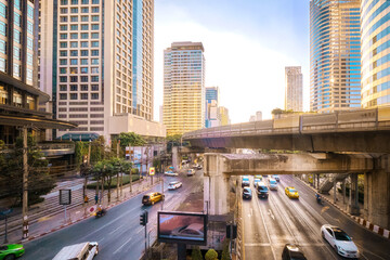 Sunny day in business downtown, light train rails and skyscrapers. 