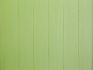 The wood grain texture of the wall panels is painted green, suitable for background use.