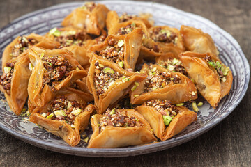 Traditional Arabic dessert Baklava  with nuts and sweet syrup.   