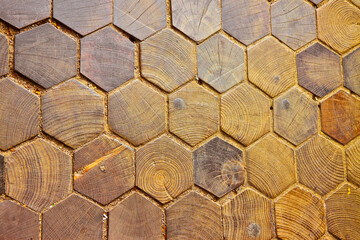 Old wooden floor with hexagonal shaped tiles