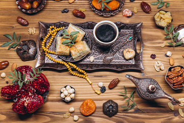 Ramadan table top view. Banner with traditional Arabic dishes, cup of coffee and food sets