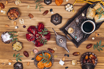 Ramadan table top view. Banner with traditional Arabic dishes, cup of coffee and food sets
