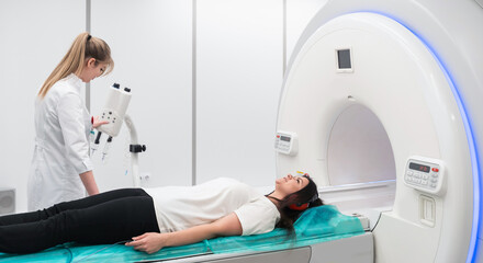 Female patient undergoing MRI - Magnetic resonance imaging in Hospital. Medical Equipment and Health Care