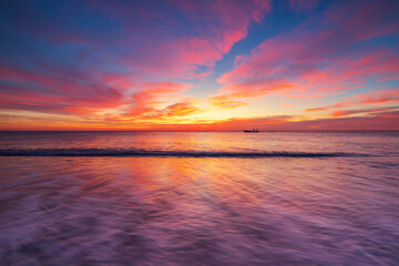 Naklejka na ściany i meble Beautiful sunrise over the sea